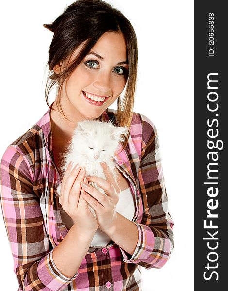 The girl with a white kitten on white background