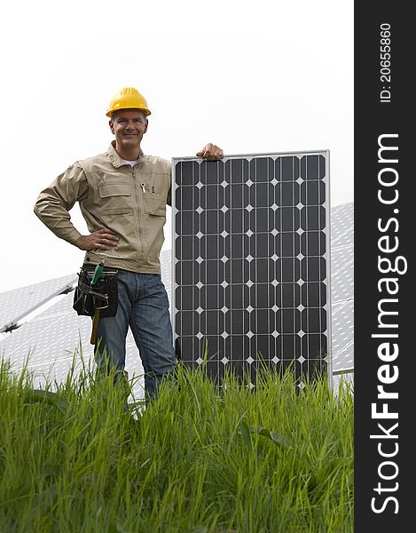 Technician with a solar panel. Technician with a solar panel