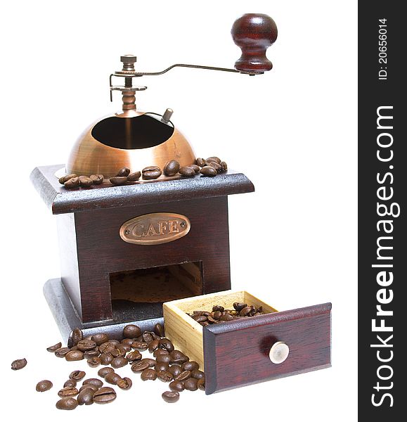 Coffee grinder with coffee beans on the white background