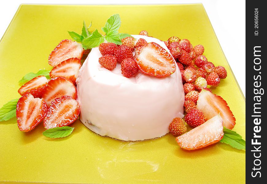 Fruit strawberry dessert with pudding and mint