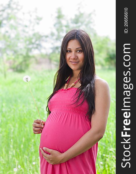 Pregnant girl outdoors portrait