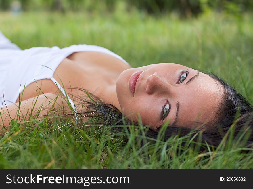 Portrait of a girl outdoors on the grass