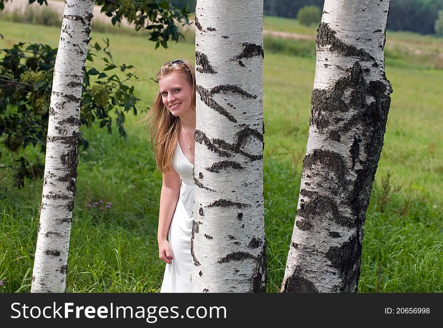 Beauty blonde with trees in summer. Beauty blonde with trees in summer