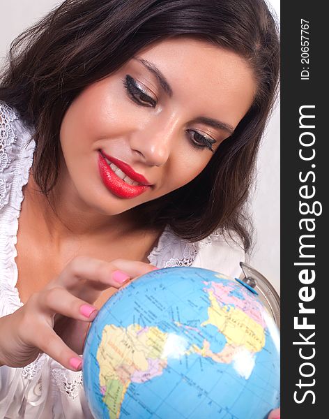 Teen girl smileing with globe in the hand. Teen girl smileing with globe in the hand