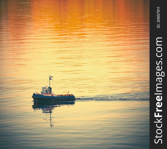 Toy boat with Russian flag colors in the water. Square format. Toy boat with Russian flag colors in the water. Square format.