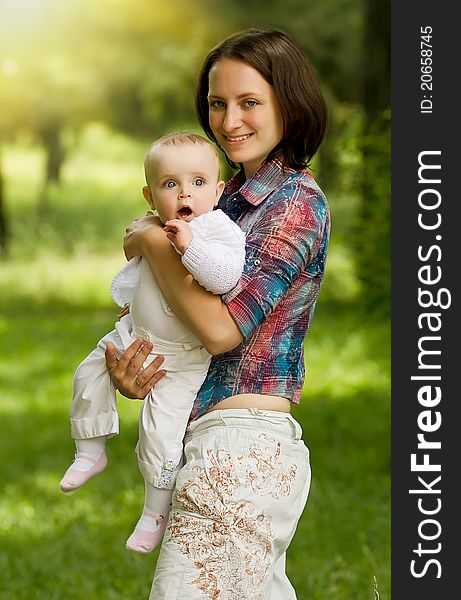 Mother with baby playing in the park