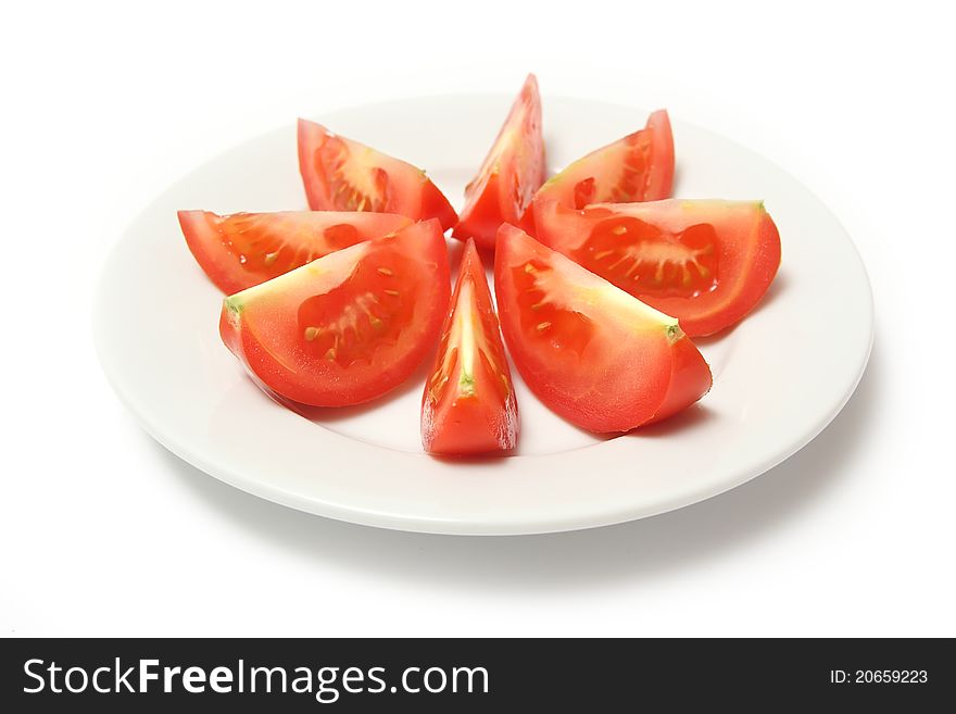 Tomatoes on white porcelain plate. Tomatoes on white porcelain plate