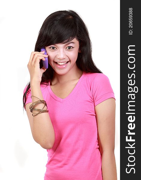 Attractive woman on the phone against a white background