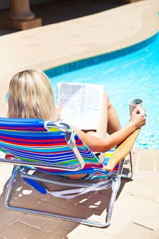 The Woman With Newspaper Near The Pool Royalty Free Stock Photos The Woman With Newspaper Near The Pool Royalty Free Stock Photos
