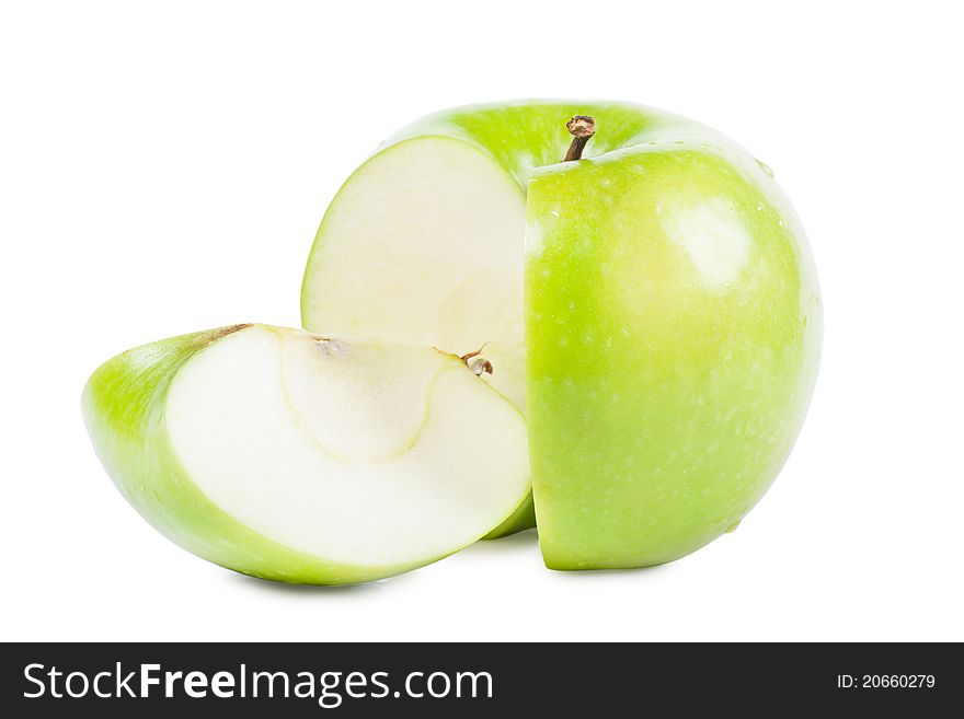 Big green apple with sliced part over white background