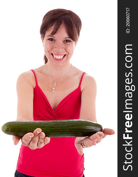 The pretty young woman holding a cucumber in his hand. The pretty young woman holding a cucumber in his hand