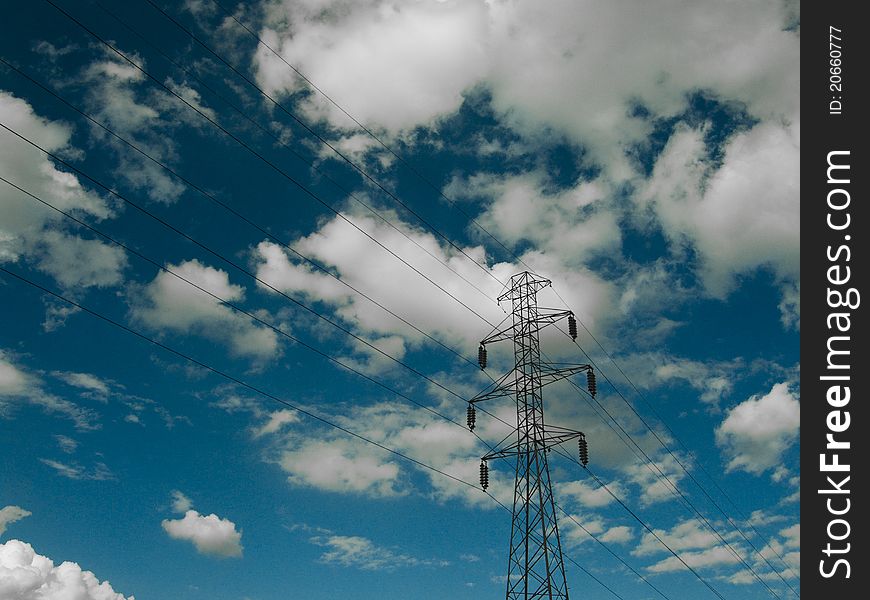 Electric power transmission lines at blue sky