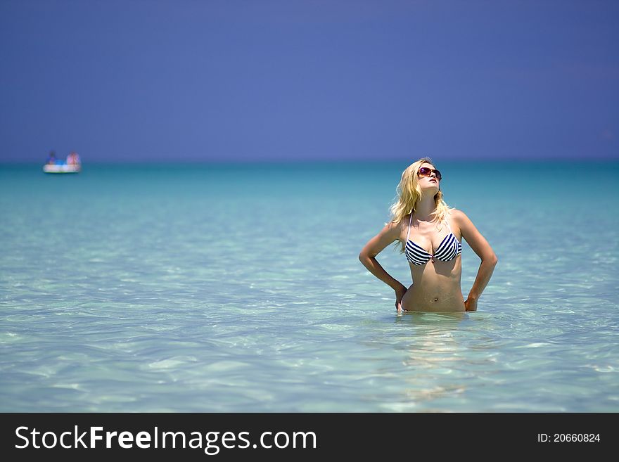 A Pretty Young Woman In Bikini Relaxing In The Sea