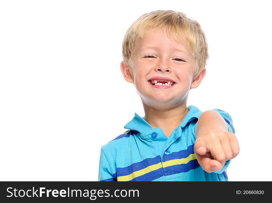 Cute boy in blue shirt pointing at viewer. Cute boy in blue shirt pointing at viewer