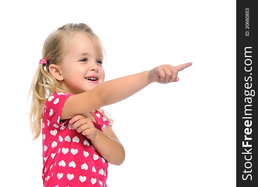 Cute blonde girl with pigtails points in a direction, isolated on white in studio. Cute blonde girl with pigtails points in a direction, isolated on white in studio