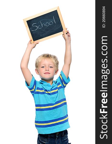 Preschool child holds a blackboard with the word school. Preschool child holds a blackboard with the word school