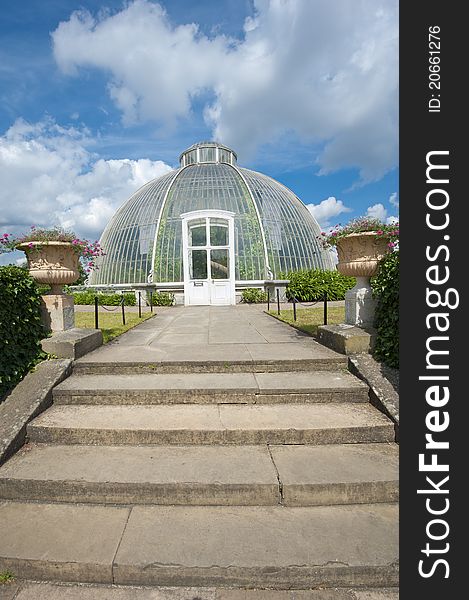 Large glasshouse structure in a public park area. Large glasshouse structure in a public park area