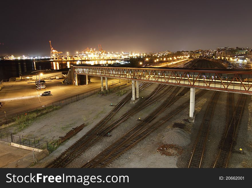 The train yard looks empty by the busy sea side docks. The train yard looks empty by the busy sea side docks.