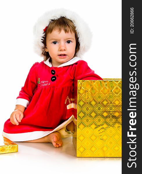 Christmas theme: little girl in santa hat with presents.
