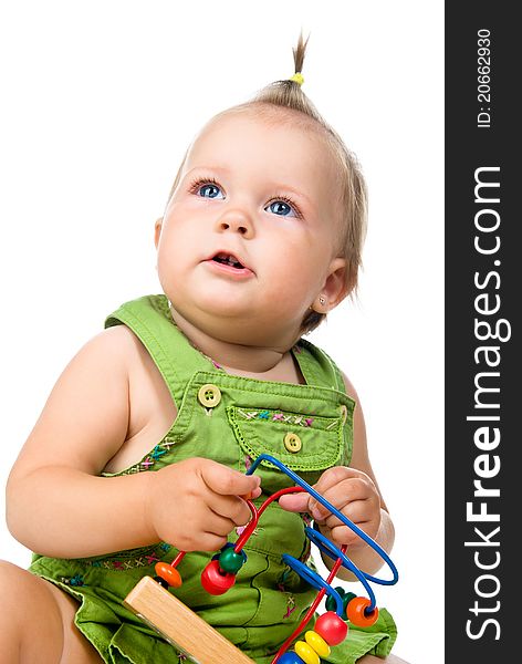 Small baby with developmental toy on a white background