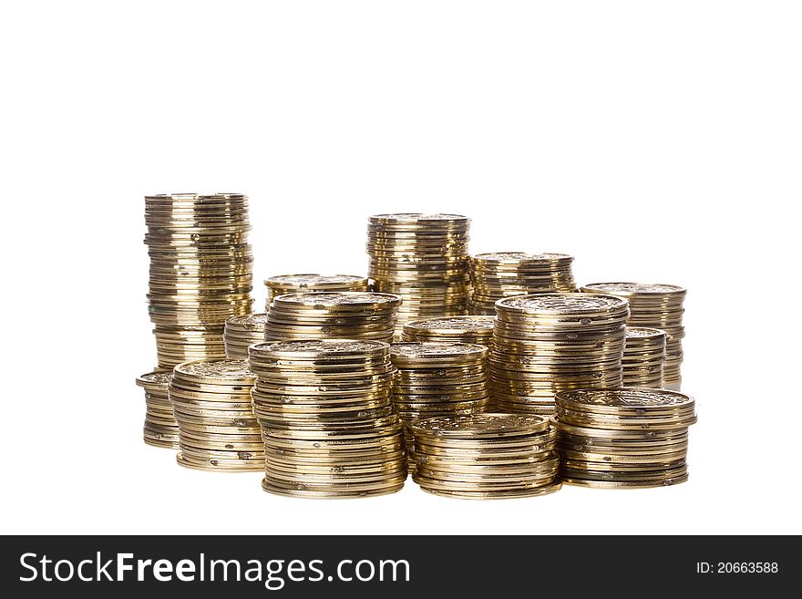 Stacks of golden coins isolated on a white background. Stacks of golden coins isolated on a white background.