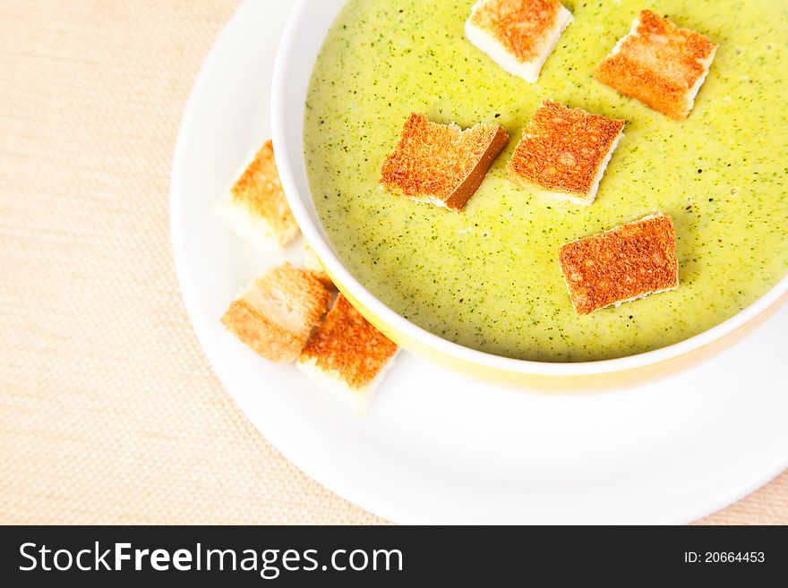 The bowl of broccoli soup with croutons. The bowl of broccoli soup with croutons