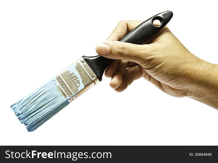 The hand of artist holding four of brushes on isolated white background. The hand of artist holding four of brushes on isolated white background