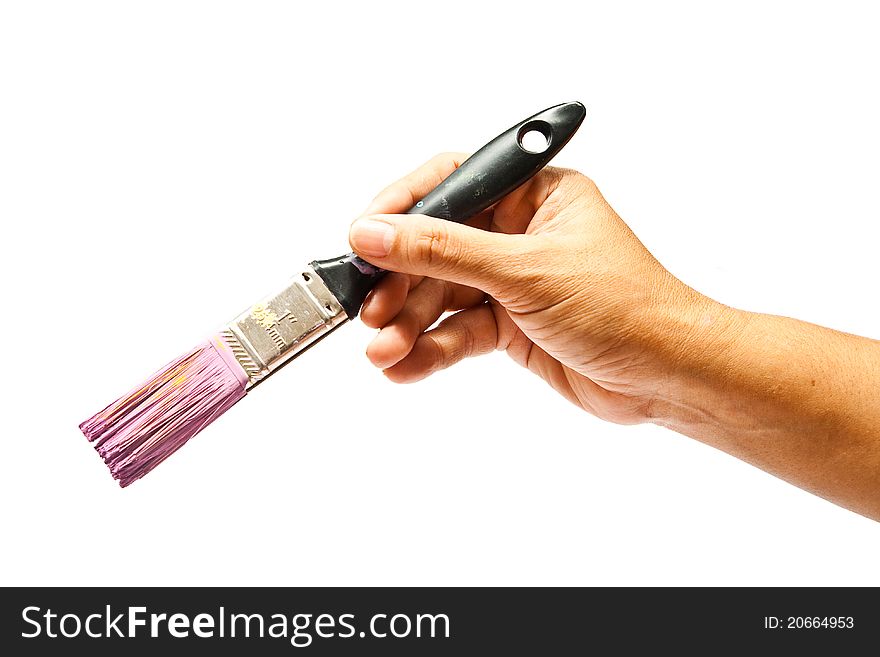 The hand of artist holding four of brushes on isolated white background. The hand of artist holding four of brushes on isolated white background