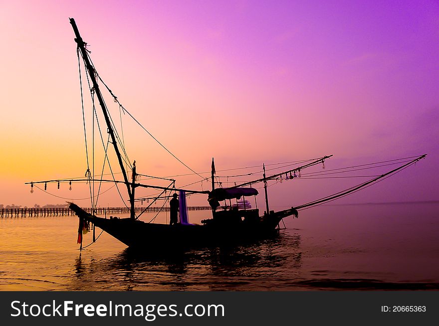 Sunset over Silhouette and the fishing boat. Sunset over Silhouette and the fishing boat