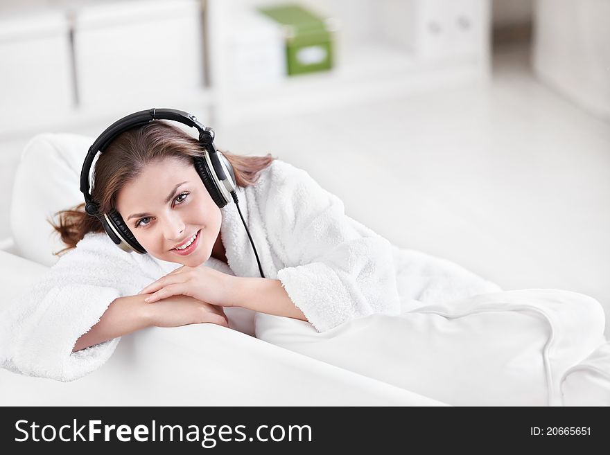 Beautiful girl with headphones at home. Beautiful girl with headphones at home