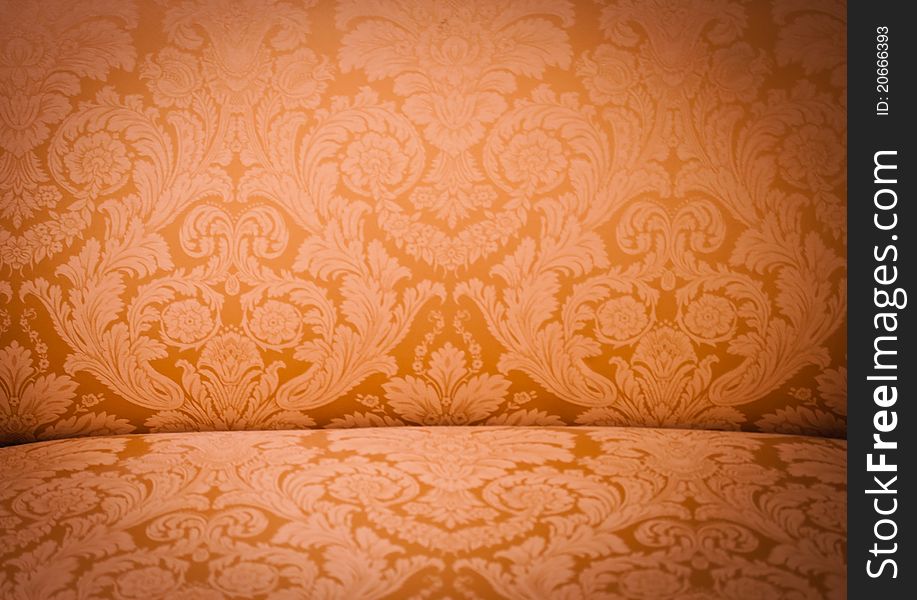 Golden Pattern on a sofa back with vignette. Golden Pattern on a sofa back with vignette