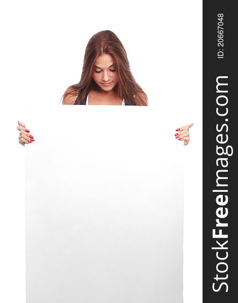 Portrait of a beautiful woman holding a blank billboard, looking out from behind it.