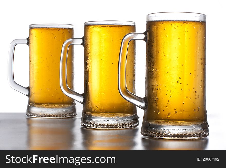 Beer mug at the table close-up, background. Beer mug at the table close-up, background