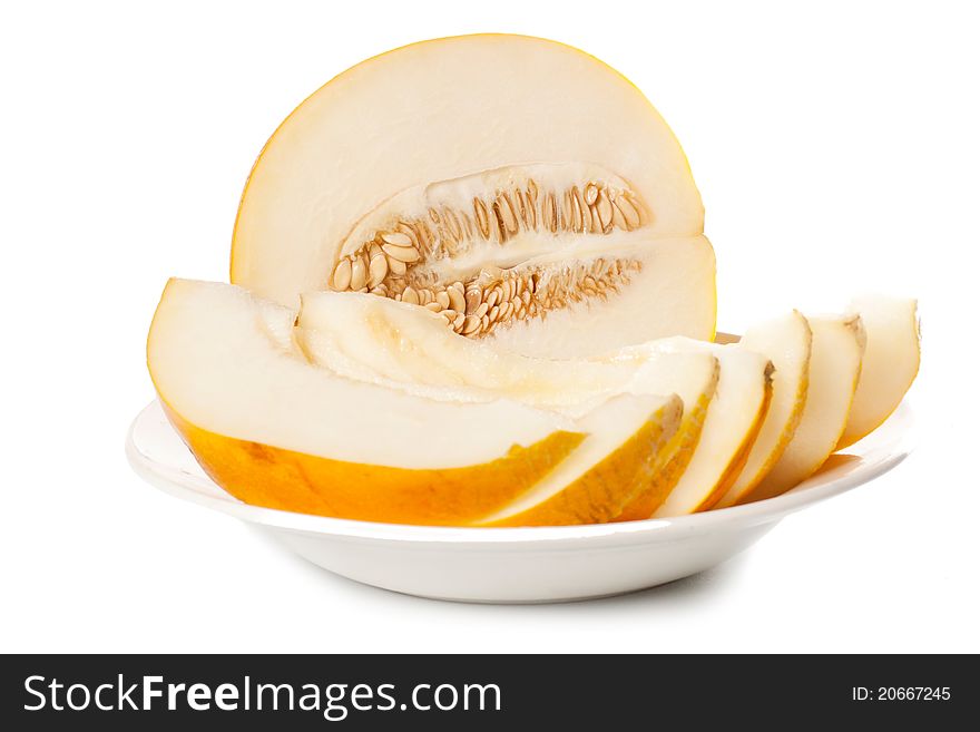 Fresh galia melon halves on a white background