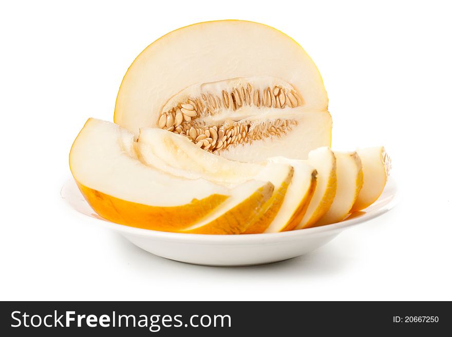 Fresh galia melon halves on a white background