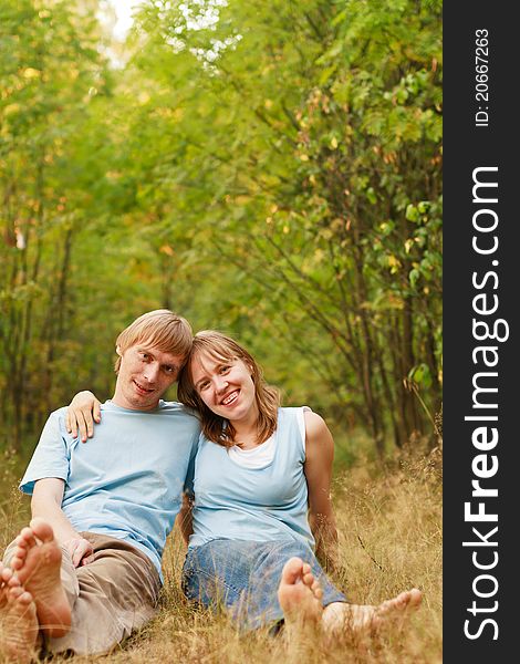 Young loving couple in summer nature. Young loving couple in summer nature