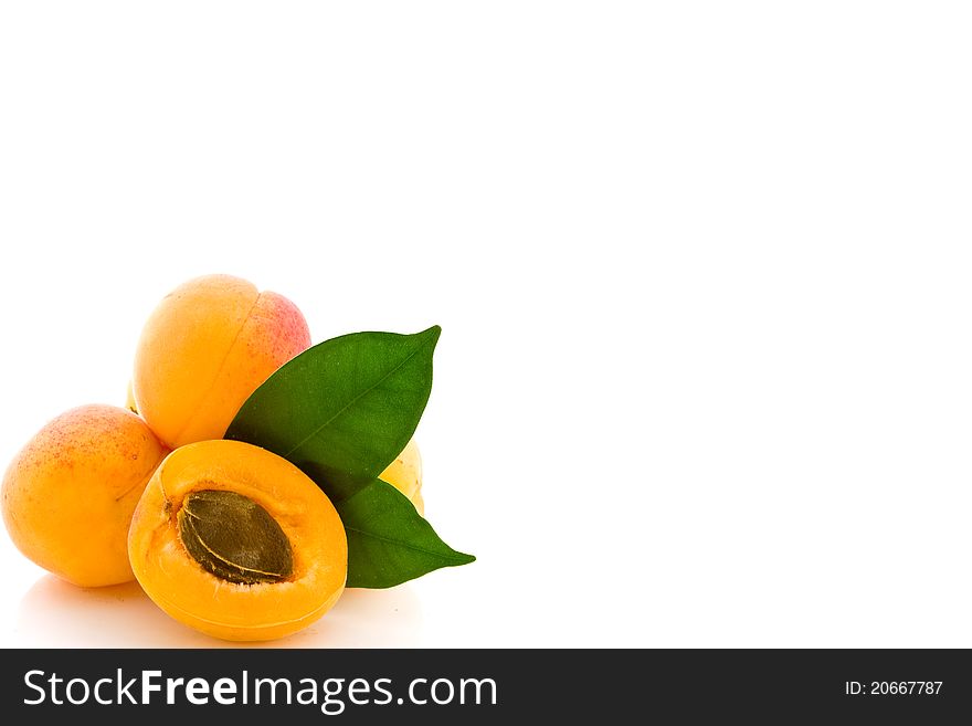 Photo of delicious apricot with leaves on white background. Photo of delicious apricot with leaves on white background
