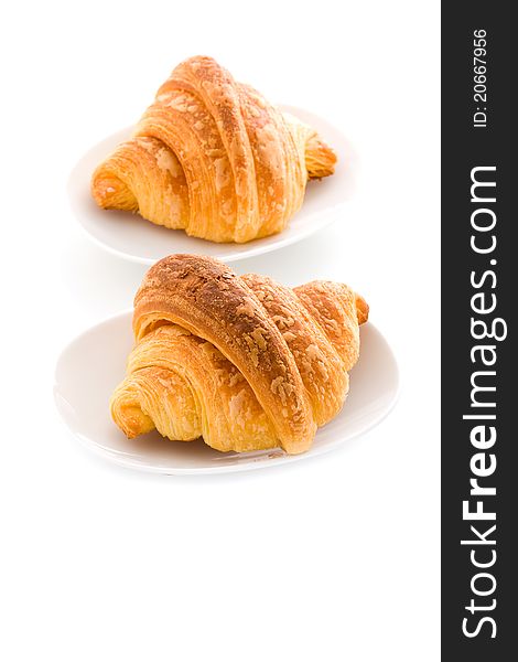 Photo of delicious tasty golden croissants on white background