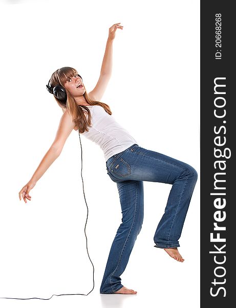 Lovely girl listening a music in headphones, white background