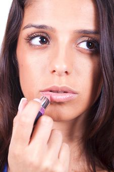 Woman Applying Lipstick Royalty Free Stock Photography Woman Applying Lipstick Royalty Free Stock Photography