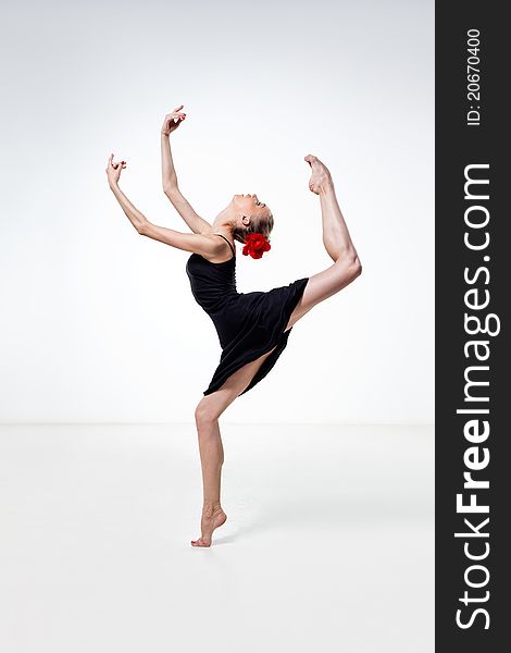 Young and beautiful dancer posing in studio. Young and beautiful dancer posing in studio