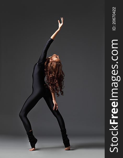 Young and beautiful dancer posing in studio. Young and beautiful dancer posing in studio