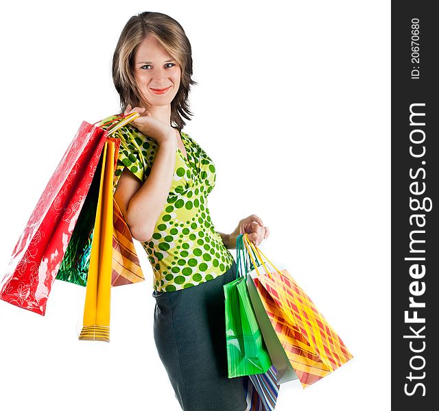 Beautiful woman with shopping bags on white