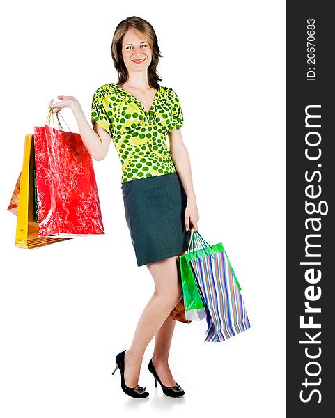 Beautiful woman with shopping bags on white