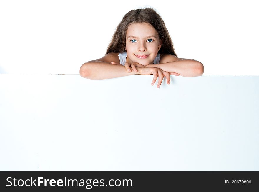 Nice girl beside a white blank for text or image. Nice girl beside a white blank for text or image