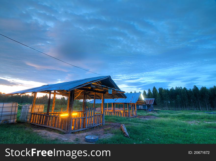 The wooden sties in the sunset time in this picture is in the rural area of northeastern thailand. The wooden sties in the sunset time in this picture is in the rural area of northeastern thailand.