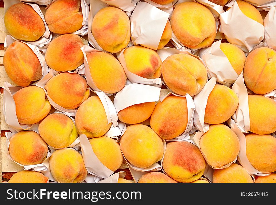 Selection of freshly picked peaches on a market stall. Selection of freshly picked peaches on a market stall