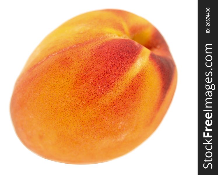 Whole peach on white background