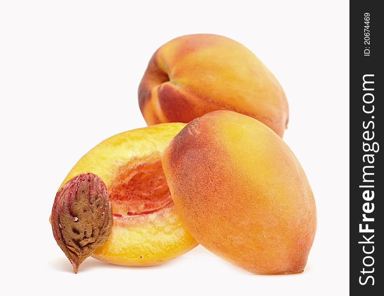 Fresh ripe peaches on white