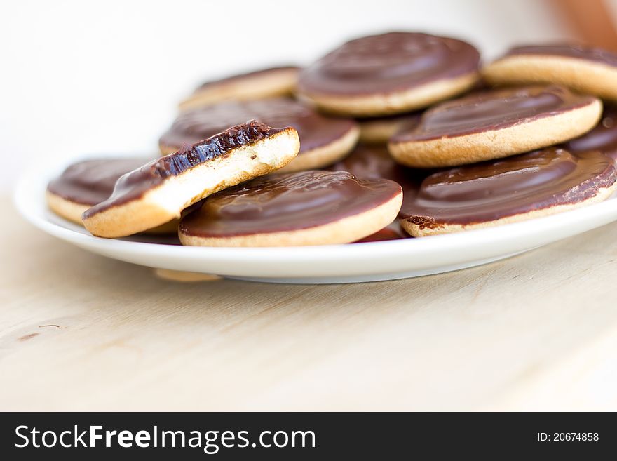 Pile of cookies on the white plate, dayligt